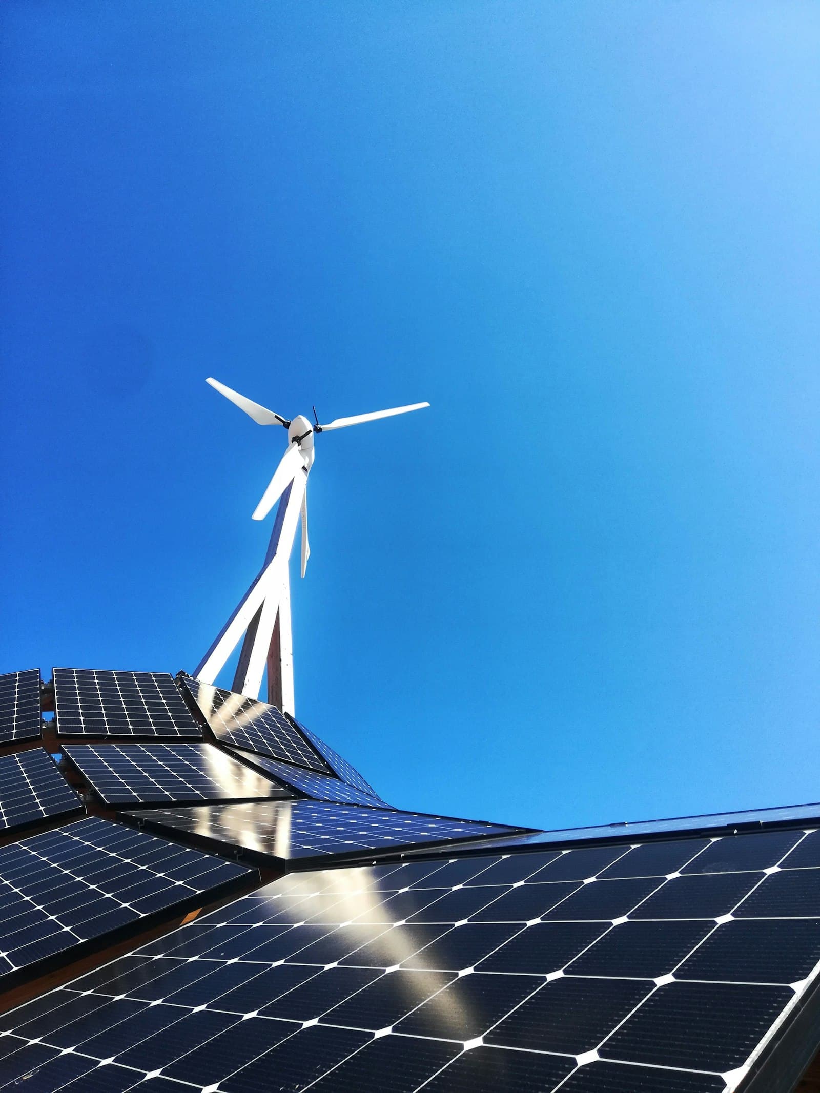 Solar panels and a wind turbine generating renewable power