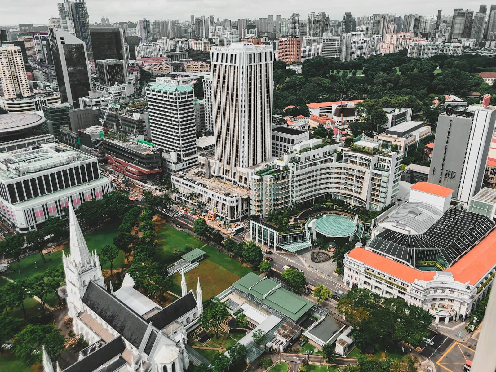 Aerial view of a dense city skyline and public spaces