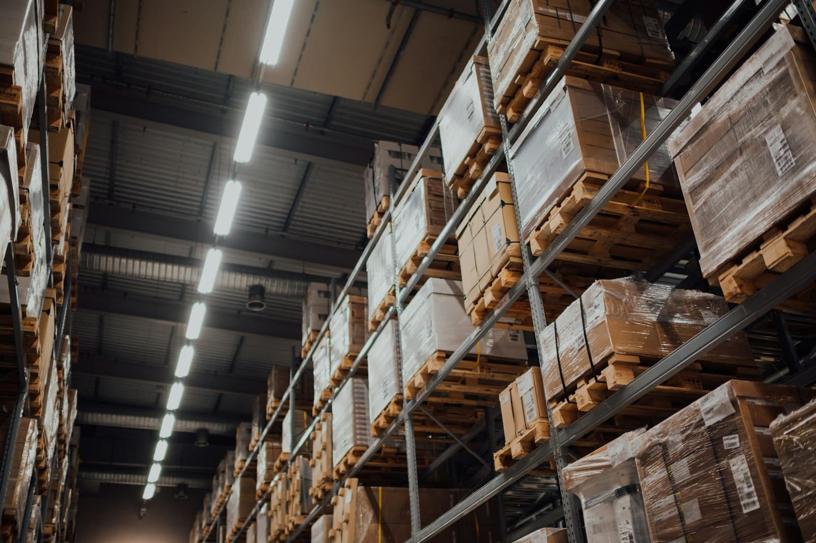 Palletised goods on high racking inside a distribution warehouse